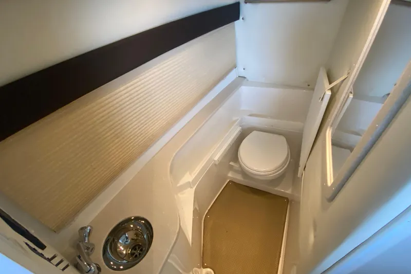 Slide: The Image of 2015 Cobalt 336 boat bathroom interior with toilet and sink. - 46