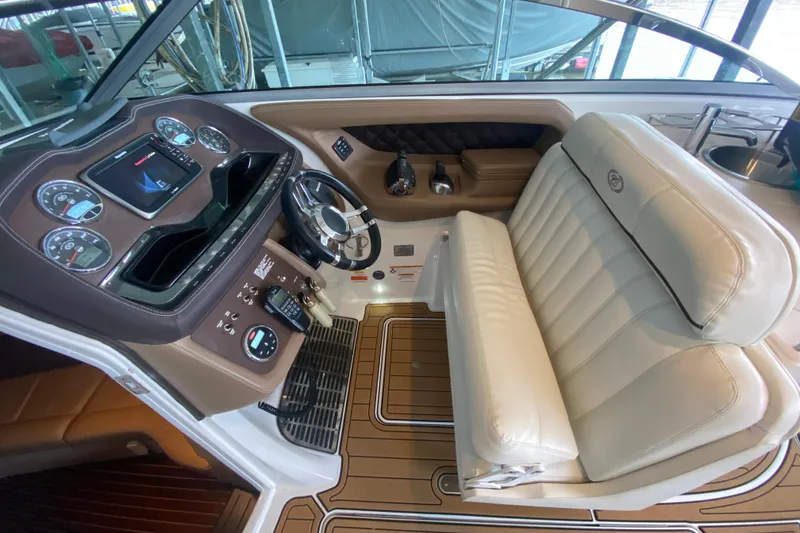 Slide: The Image of 2015 Cobalt 336 boat cockpit with leather seating and modern dashboard controls. - 24