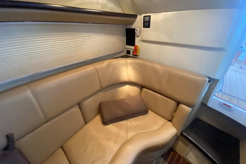 Slide: The Image of Luxurious interior of a 2015 Cobalt 336 boat with beige leather seating. - 41