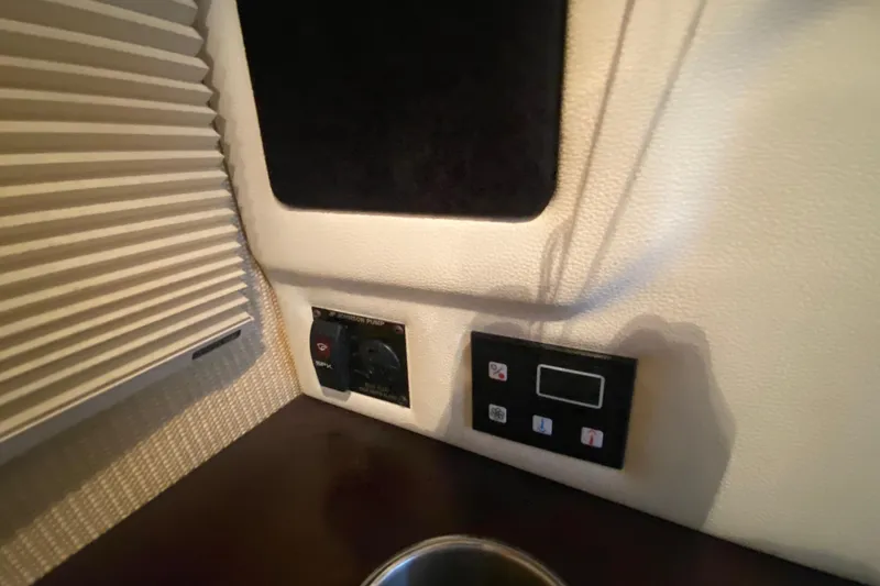 Slide: The Image of Control panel and switch inside 2015 Cobalt 336 boat cabin. - 43