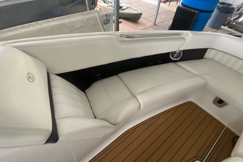 Slide: The Image of Luxurious white seating on a 2015 Cobalt 336 boat with teak flooring. - 37