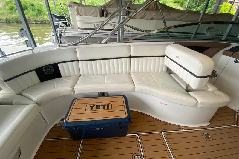 Slide: The Image of Luxurious seating on a 2015 Cobalt 336 boat with a Yeti cooler on teak flooring. - 21