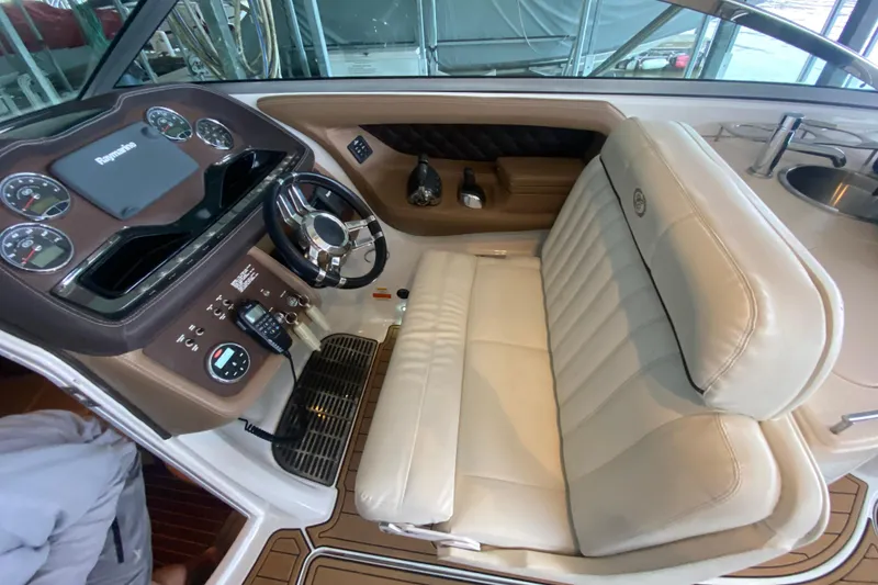 Slide: The Image of 2015 Cobalt 336 boat cockpit with leather seating and modern dashboard controls. - 25