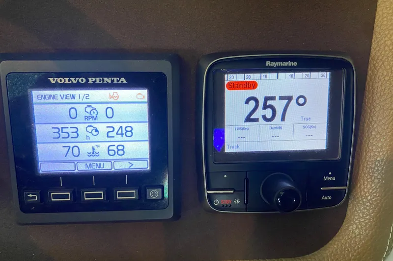 Slide: The Image of Volvo Penta and Raymarine displays on a 2015 Cobalt 336 boat dashboard. - 29