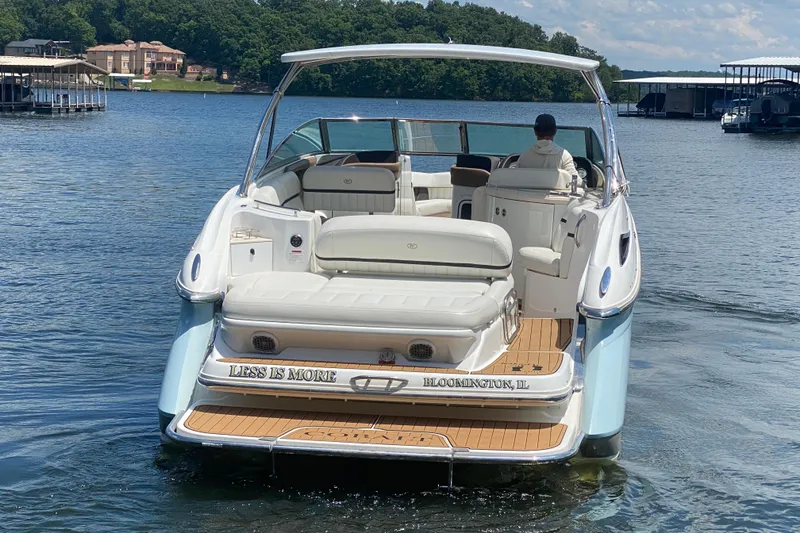 Slide: The Image of 2015 Cobalt 336 boat on a lake, featuring a spacious deck and elegant design. - 9