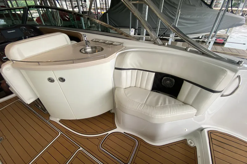 Slide: The Image of Luxurious interior of 2015 Cobalt 336 boat with seating and sink area. - 18