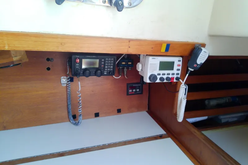 Slide: The Image of Boat communication equipment on a 1988 Brewer 44, featuring radios and control panels. - 57