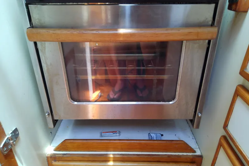 Slide: The Image of Stainless steel oven with wooden handle on a Brewer 44, 1988 model. - 49