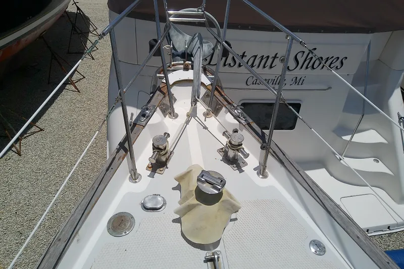 Slide: The Image of Bow of 1988 Brewer 44 sailboat "Distant Shores" in Cassville, MI, with deck fittings. - 16