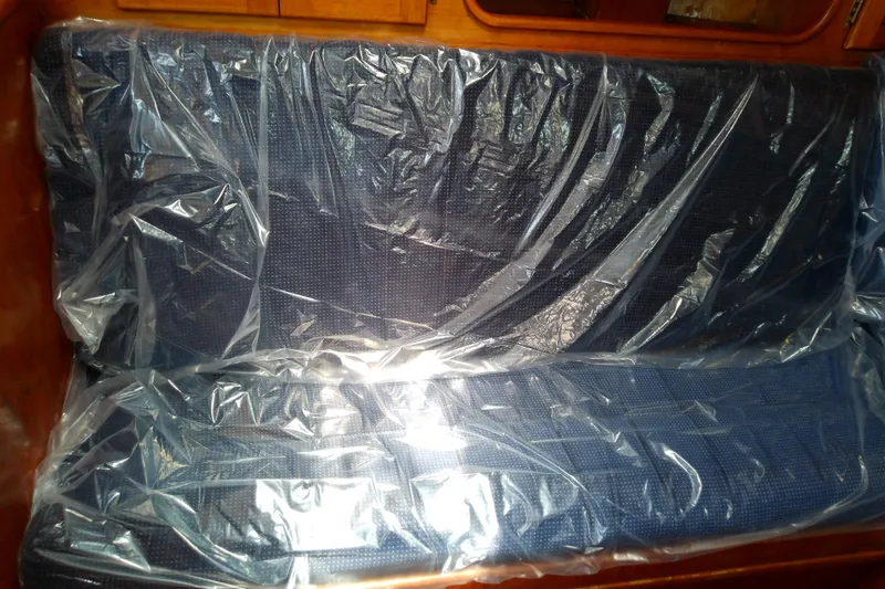 Slide: The Image of Plastic-covered blue seat cushion on a Brewer 44, 1988 model. - 64