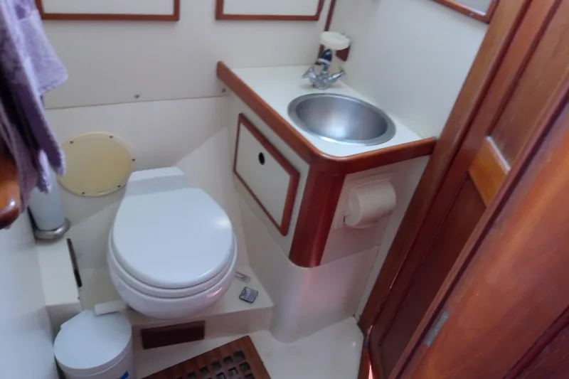 Slide: The Image of Compact boat bathroom with toilet and sink, Brewer 44 model, 1988. - 69