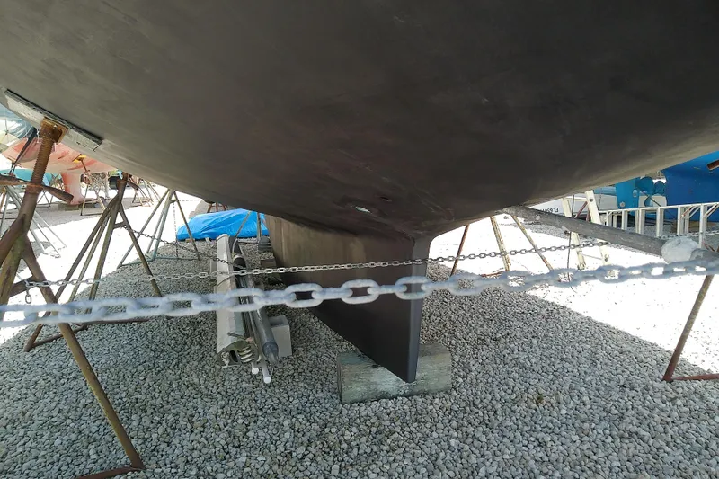 Slide: The Image of Bottom view of a 1988 Brewer 44 sailboat on stands, showing keel and hull details. - 13