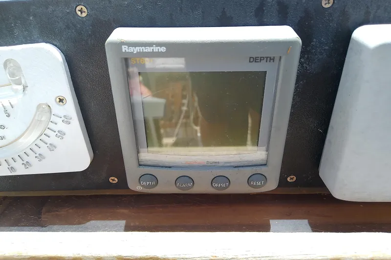 Slide: The Image of Raymarine ST60 depth gauge on Brewer 44, 1988 model, with control buttons. - 39