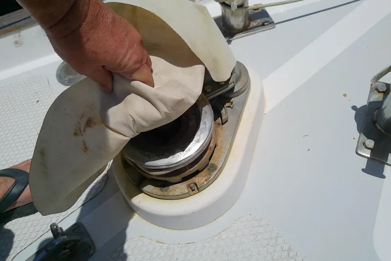Slide: The Image of Hand adjusting winch on 1988 Brewer 44 sailboat deck. - 17