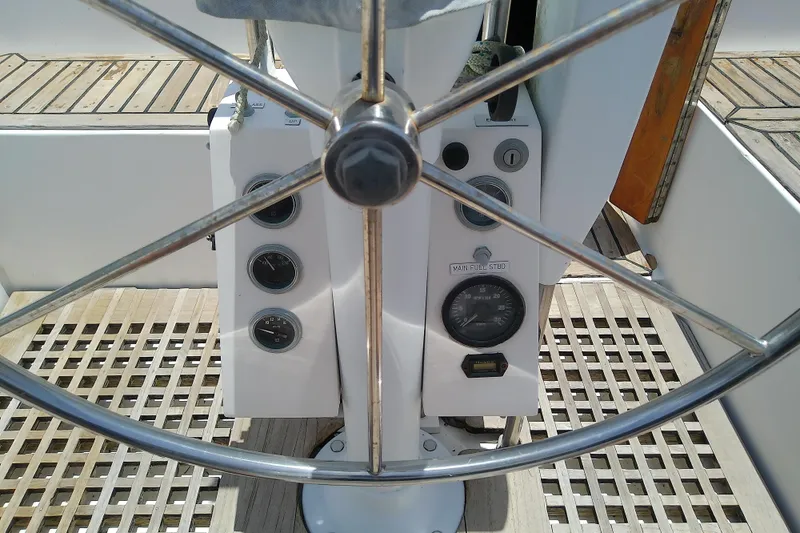 Slide: The Image of Steering wheel and control panel of a 1988 Brewer 44 sailboat. - 37
