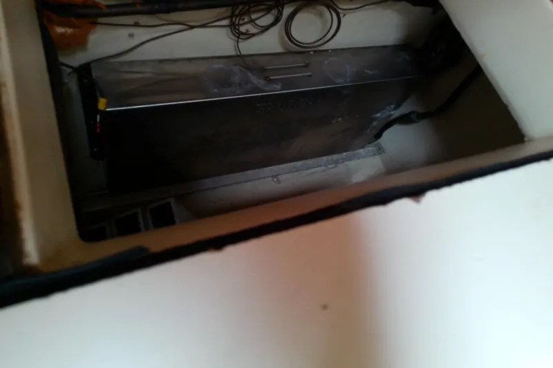 Slide: The Image of 1988 Brewer 44 engine compartment with visible wiring and metal components. - 51
