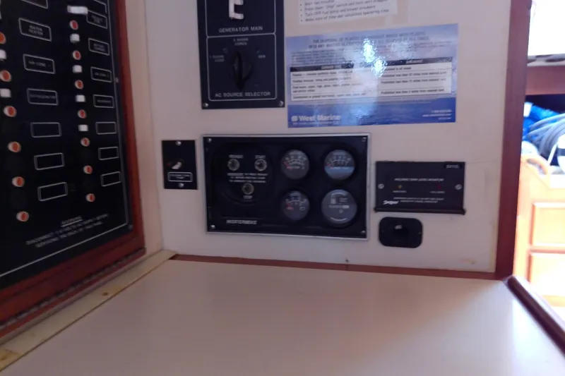 Slide: The Image of Control panel of a 1988 Brewer 44 boat with gauges and switches. - 62