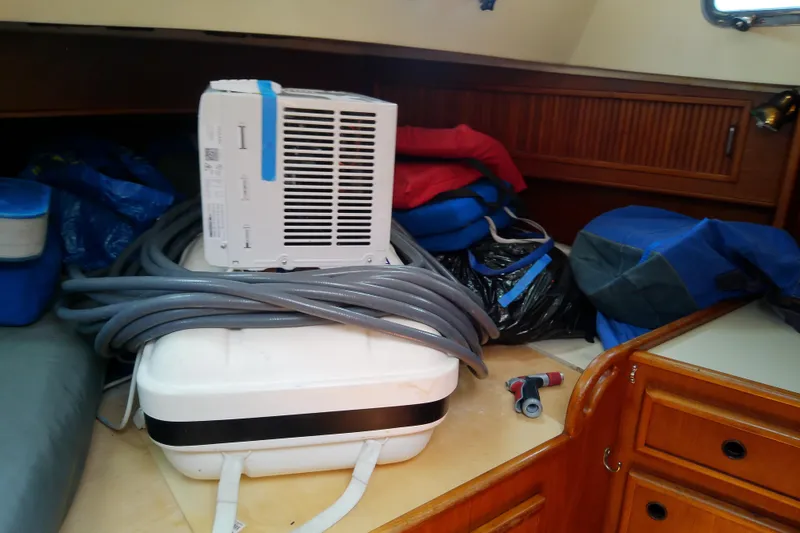 Slide: The Image of Interior of 1988 Brewer 44 boat with equipment and storage items. - 79