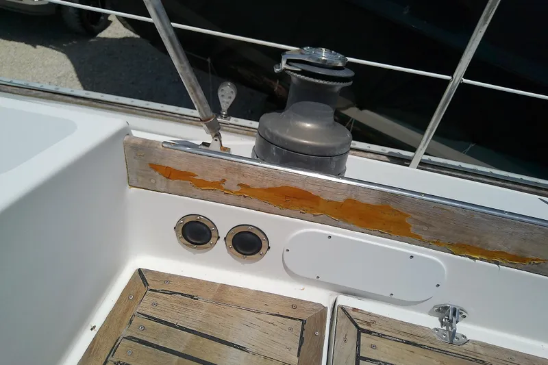 Slide: The Image of Cockpit of 1988 Brewer 44 sailboat with weathered wood and winch. - 31