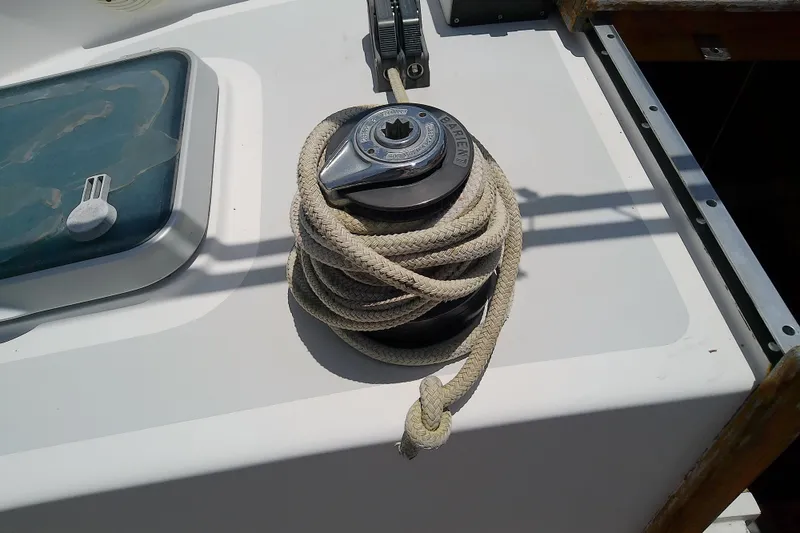 Slide: The Image of Sailboat winch with coiled rope on a 1988 Brewer 44 deck. - 33