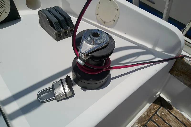 Slide: The Image of Sailboat deck with winch, rope, and padlock; Brewer 44, 1988 model. - 34