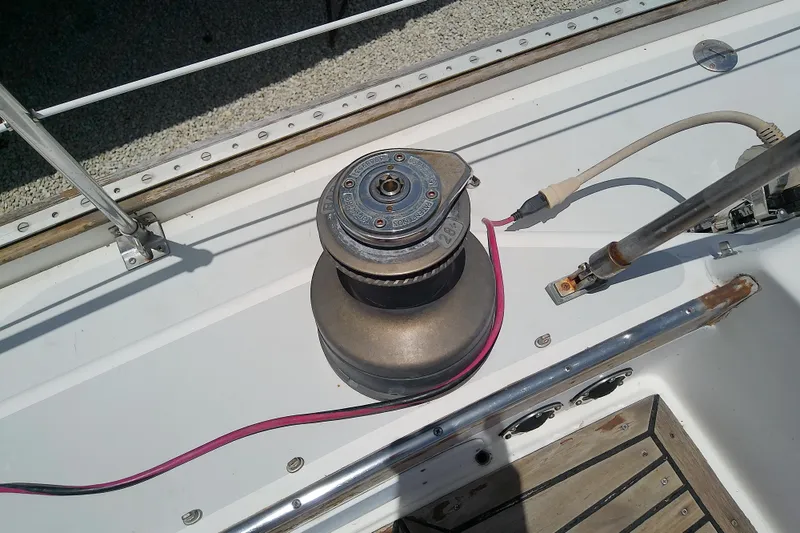 Slide: The Image of Winch on 1988 Brewer 44 sailboat deck with pink rope and metal fittings. - 28