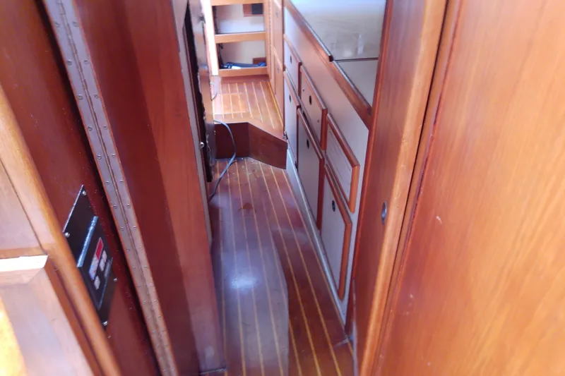 Slide: The Image of Interior of 1988 Brewer 44 yacht with wooden cabinetry and flooring. - 77