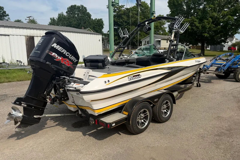 Slide: The Image of 2013 Triton 220 Escape boat with Mercury Pro XS engine on trailer. - 7
