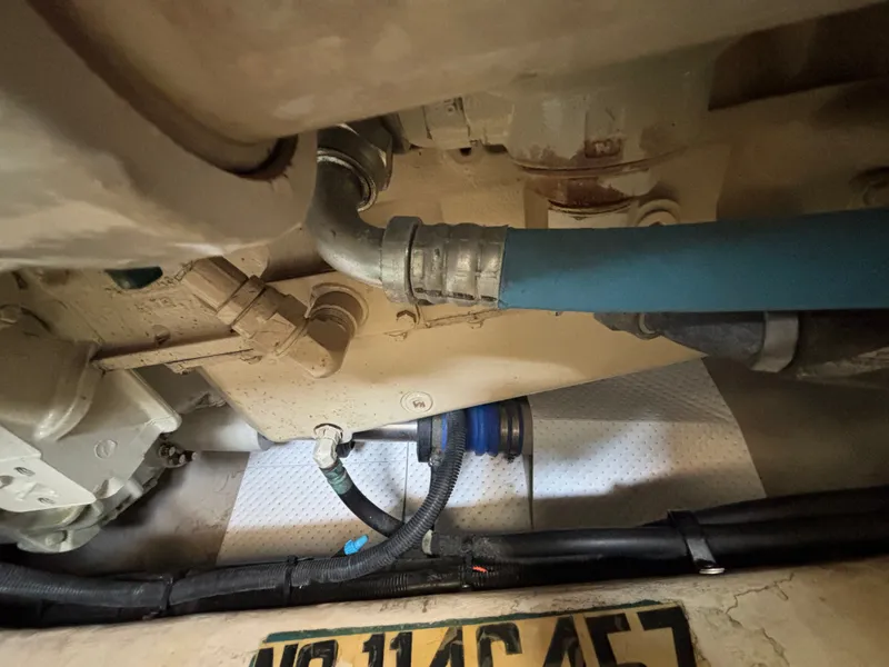 Slide: The Image of Close-up of an engine compartment with hoses and cables. - 30