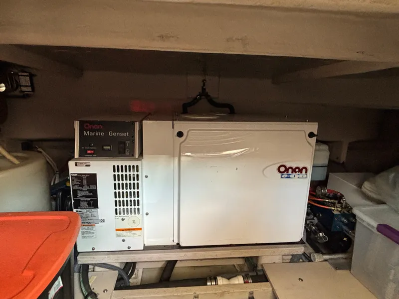 Slide: The Image of An Onan marine generator is installed in the engine room of a 2003 Sea Ray 500 Sundancer. - 33
