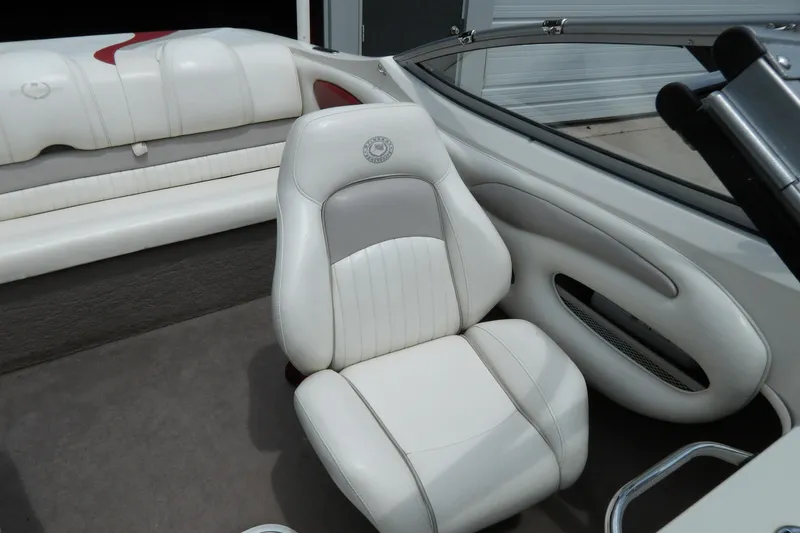 Slide: The Image of 2012 Stingray 195 LS/LX boat interior with white leather seating and sleek design. - 14