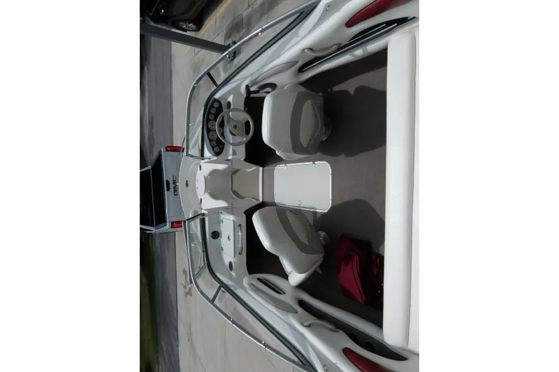 Slide: The Image of 2012 Stingray 195 LS/LX boat interior with steering wheel and seating. - 11