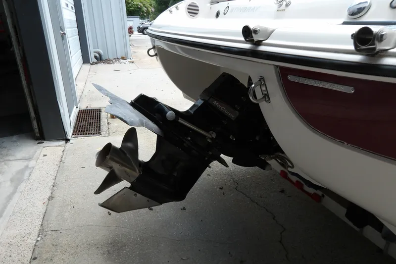 Slide: The Image of 2012 Stingray 195 LS/LX boat with MerCruiser outdrive in a garage setting. - 9