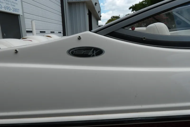 Slide: The Image of 2012 Stingray 195 LS/LX boat side view with model emblem. - 5