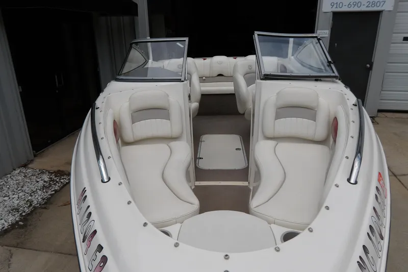 Slide: The Image of 2012 Stingray 195 LS/LX boat with white interior and dual windshields. - 3