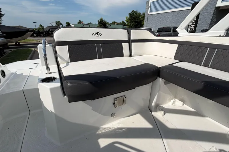 Slide: The Image of Luxury seating on a 2022 Monterey M4 boat, featuring sleek black and white upholstery. - 32