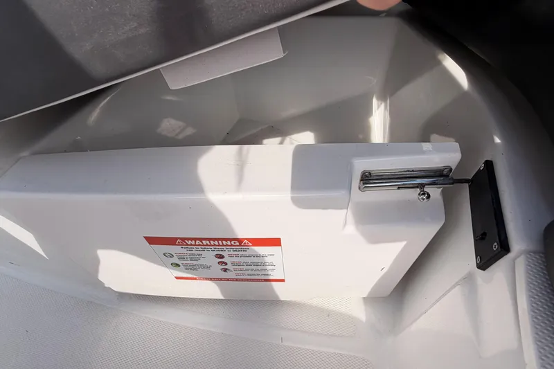 Slide: The Image of Storage compartment with warning label in 2022 Monterey M4 boat. - 6