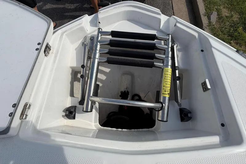 Slide: The Image of 2022 Monterey M4 boat with a folded stainless steel swim ladder on deck. - 5