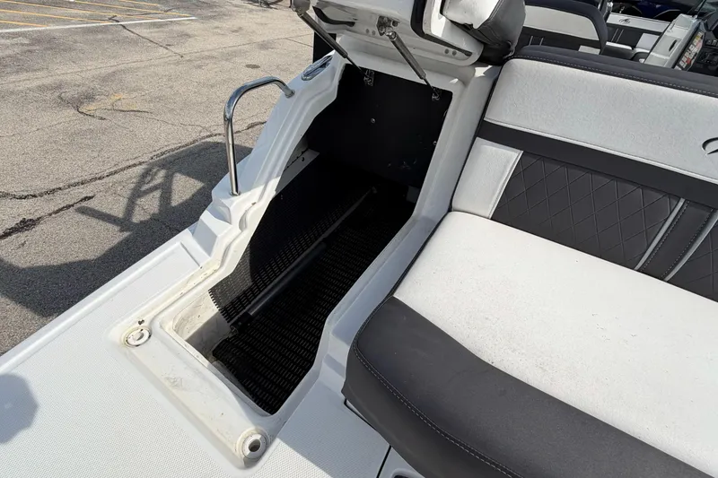 Slide: The Image of 2022 Monterey M4 boat interior with seating and storage compartment. - 19