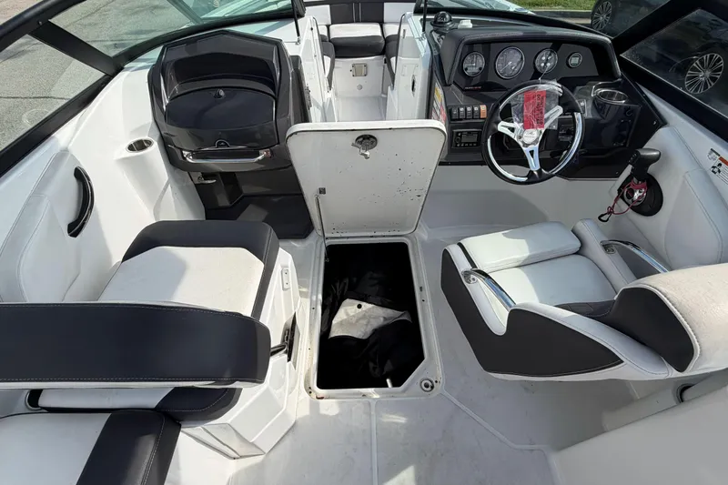Slide: The Image of Interior of a 2022 Monterey M4 boat, featuring sleek seating and modern dashboard controls. - 9