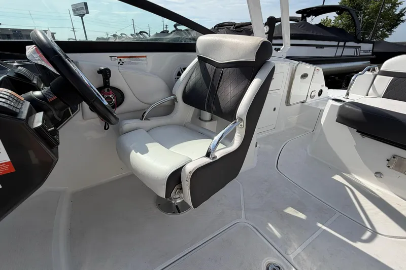 Slide: The Image of Captain's seat and helm of a 2022 Monterey M4 boat, showcasing sleek design and controls. - 35