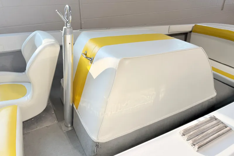 Slide: The Image of 1978 Correct Craft Ski Nautique interior with white and yellow seating and ski pole. - 12