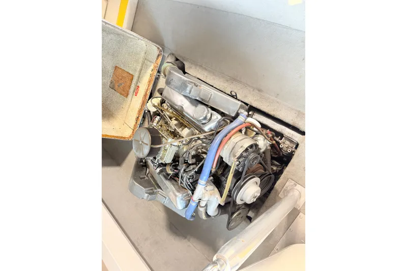 Slide: The Image of 1978 Correct Craft Ski Nautique engine compartment with visible components and wiring. - 6