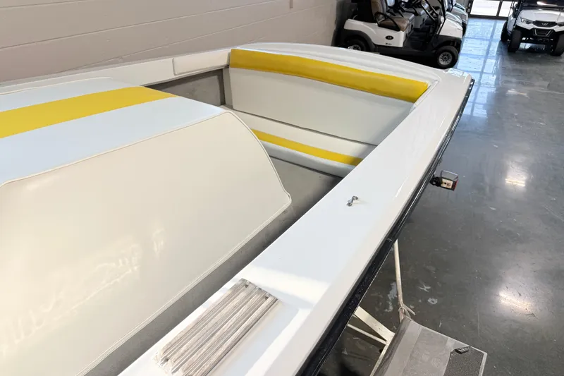 Slide: The Image of 1978 Correct Craft Ski Nautique boat interior with yellow and white seating. - 11