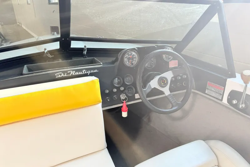 Slide: The Image of Interior of a 1978 Correct Craft Ski Nautique boat with steering wheel and dashboard. - 15