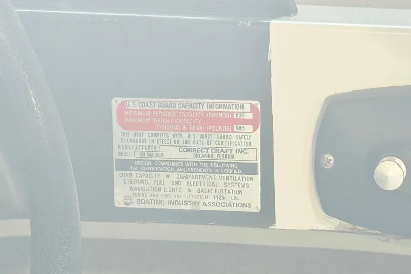 Slide: The Image of 1978 Correct Craft Ski Nautique capacity plate detailing U.S. Coast Guard safety standards. - 14