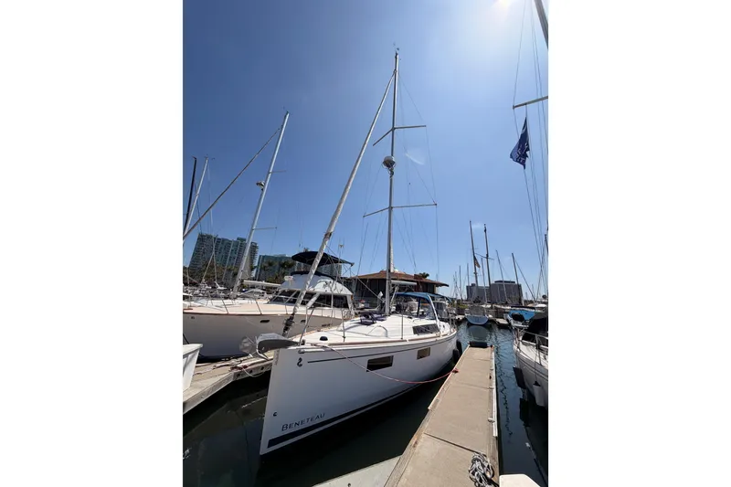 Slide: The Image of 2018 Beneteau Oceanis 35.1 sailboat docked in a sunny marina. - 3