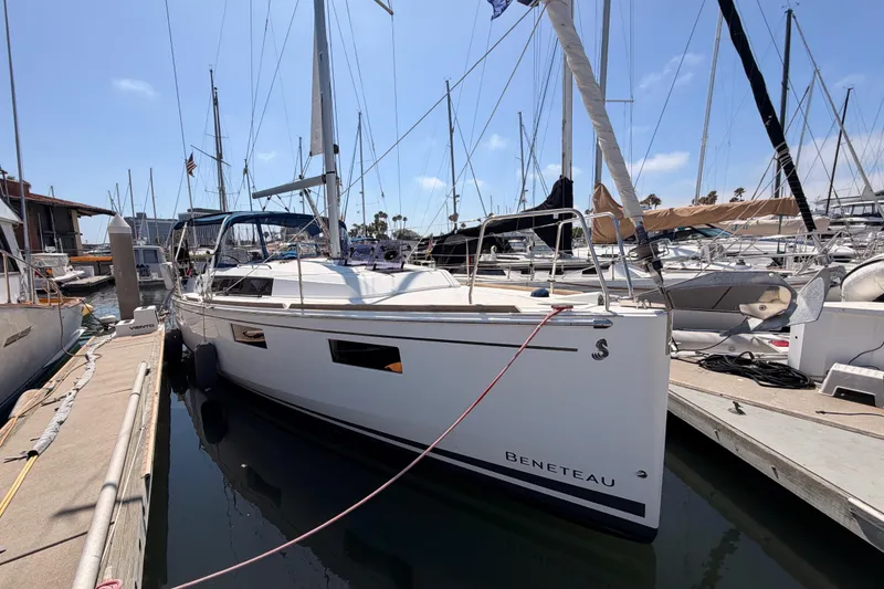 Slide: The Image of 2018 Beneteau Oceanis 35.1 sailboat docked at marina under clear sky. - 5