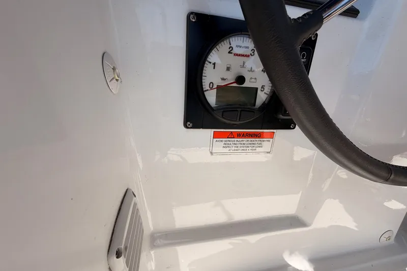 Slide: The Image of Control panel of a 2018 Beneteau Oceanis 35.1 sailboat with Yanmar gauge and warning label. - 29