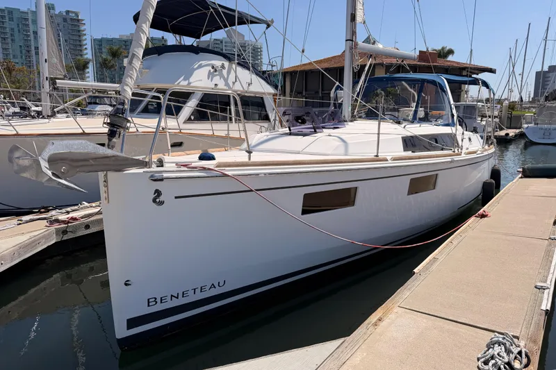 The Image of 2018 Beneteau Oceanis 35.1 sailboat docked at marina, sunny day. - 2